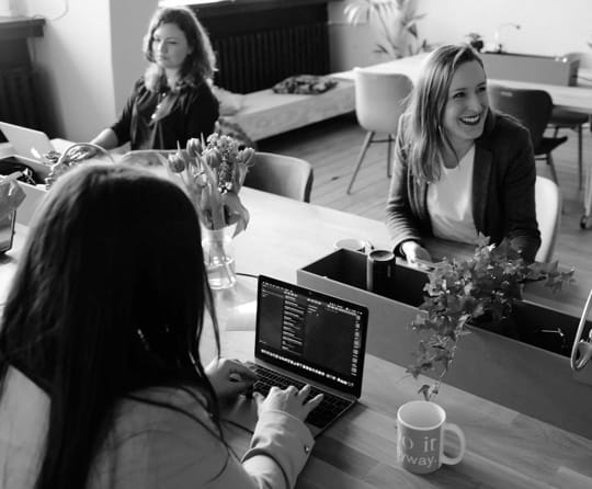 Businesss people sitting down on a chair on a bigger screen